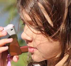 Young girl with CapMedic inhaler