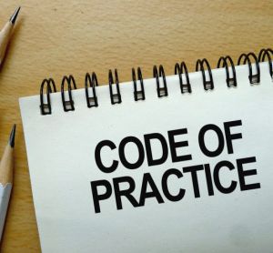 Code of Practice text written on a notebook