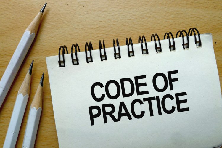 Code of Practice text written on a notebook