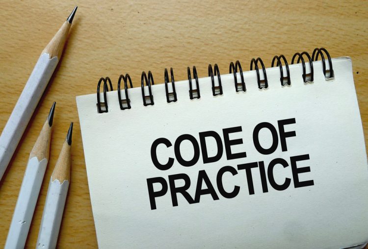 Code of Practice text written on a notebook