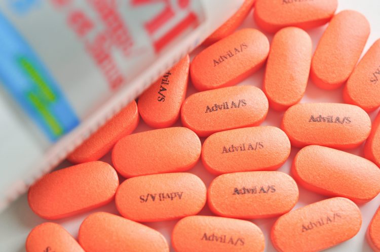 orange tablets labelled with 'Advil A/S'
