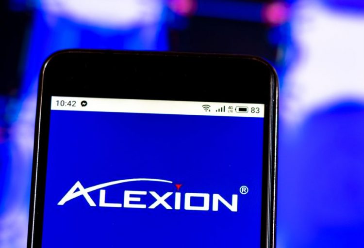 Alexion Pharmaceuticals company logo displayed on a smart phone screen [Credit: IgorGolovniov/Shutterstock.com].