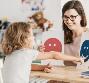 autistic child receiving therapy from psychiatrist