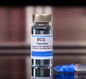 Vial labelled 'BCG Injection' next to a syringe - idea of BCG vaccine