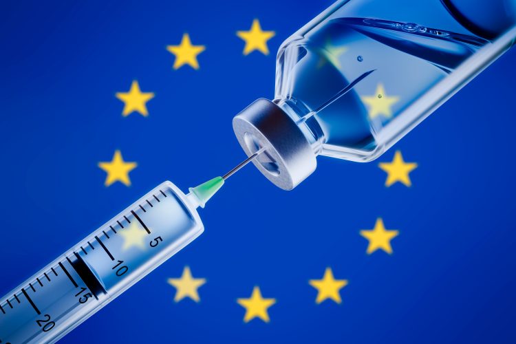 syringe drawing from a vial in front of the EU flag (blue with a central circle of golden stars) - vaccines are an example of biopharmaceuticals