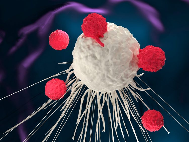 Red CAR T cells attacking a central larger white 'cancer' cell on a dark turquoise background - idea of CAR T-cell therapy