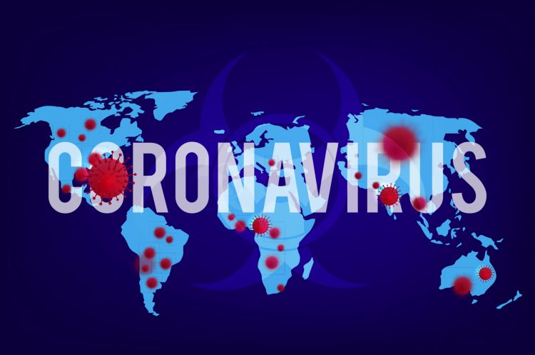 World map with countries is glowing light blue on a dark blue background, overlaid with word 'coronavirus' in white with red virus particles