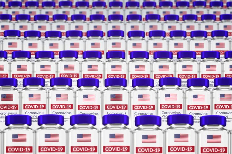 Vials labelled with the US flag and 'COVID-19 VACCINE) - idea of US vaccines/vaccine allocation