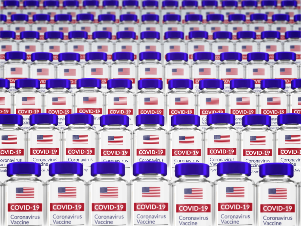 Vials labelled with the US flag and 'COVID-19 VACCINE) - idea of US vaccines/vaccine allocation