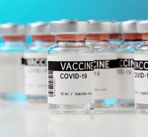 Vials labelled 'VACCINE COVID-19'