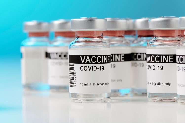 Vials labelled 'VACCINE COVID-19'