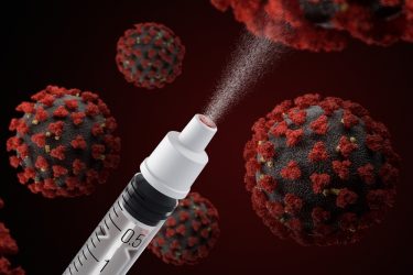 Nasal vaccine against COVID-19 concept - SARS-CoV-2 viral particles surrounding a nasal vaccine syringe