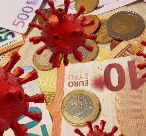 Red coronavirus particles overlaid on euro notes