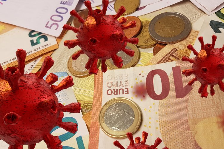 Red coronavirus particles overlaid on euro notes