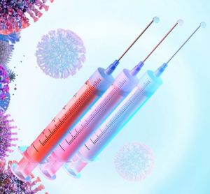 concept of COVID-19 vaccine booster - three syringes of liquid (vaccine doses) next to a series of SARS-CoV-2 virus particles