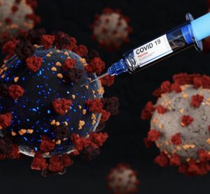 Black and red coronavirus particle being injected by a syringe labelled 'COVID-19 VACCINE'