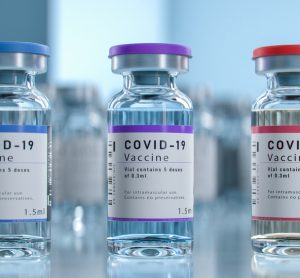 Three vials each labelled 'COVID-19 Vaccine'
