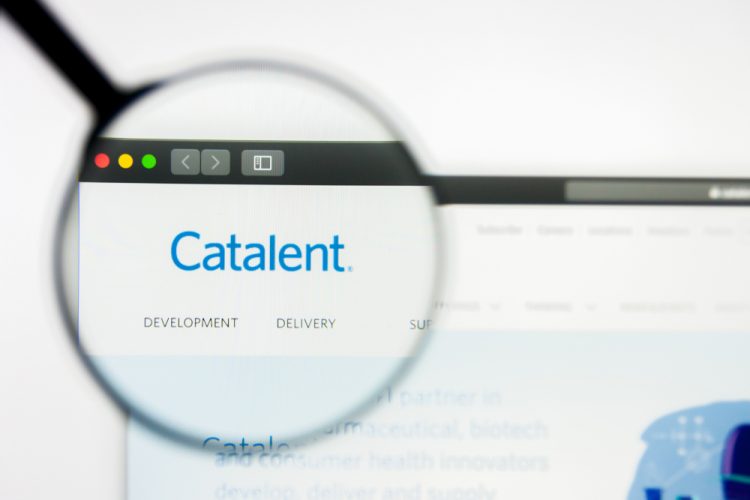 Catalent logo on website through a magnifying glass [Credit: Pavel Kapysh/Shutterstock.com].