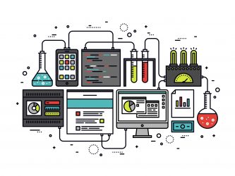 various test tubes connected to computers/technology - idea of lab automation/connectivity