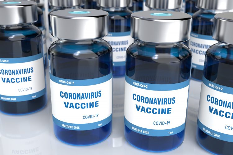 vials of blue liquid labelled 'CORONAVIRUS VACCINE COVID-19'