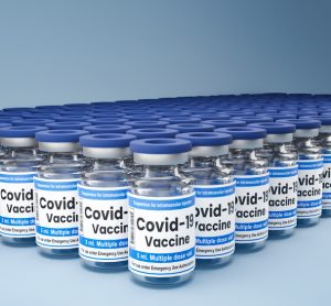 Hundreds of vials labelled 'COVID-19 vaccine' lined up in rows - idea of COVID-19 vaccine supply/distribution