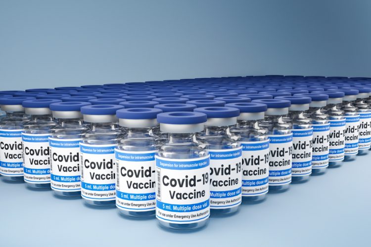 Hundreds of vials labelled 'COVID-19 vaccine' lined up in rows - idea of COVID-19 vaccine supply/distribution