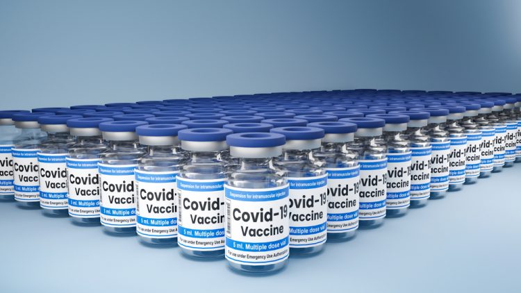 Hundreds of vials labelled 'COVID-19 vaccine' lined up in rows - idea of COVID-19 vaccine supply/distribution