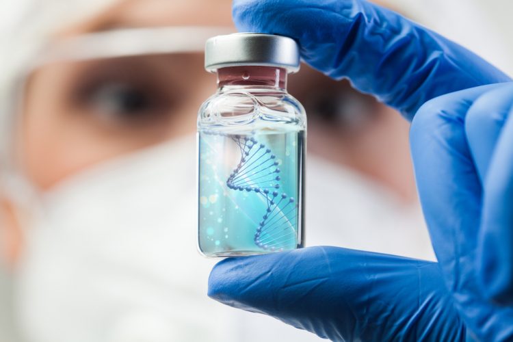 Doctor holding up a vaccine vial with a DNA strand in it - idea of DNA vaccine