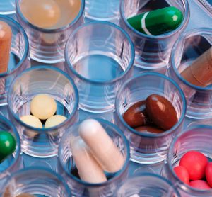 color pills and capsules in plastic tray