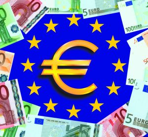 Symbol for euros in centre of European Union flag (blue with a central circle of golden stars) surrounded by Euro bank notes - idea of EU funding