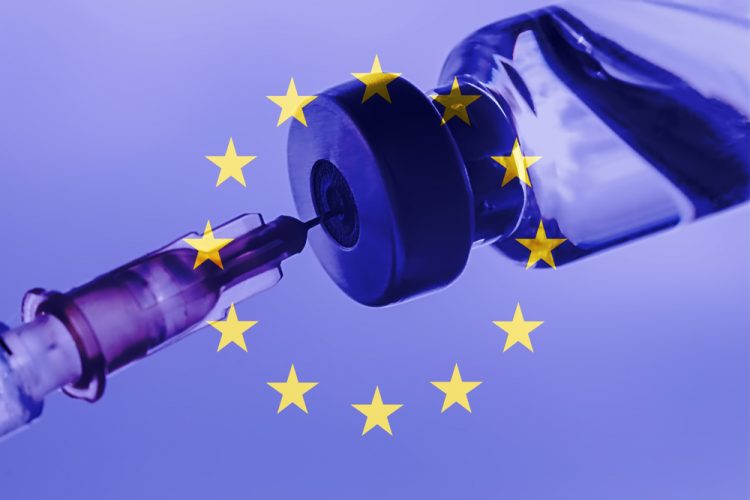 Syringe drawing a vaccine dose from a vial overlaid with the EU flag (blue with central circle of golden stars)