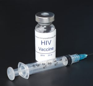 Hypothetical AIDS/HIV vaccine with syringe on black background