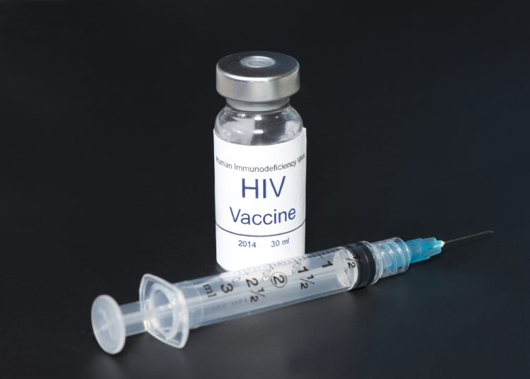 Hypothetical AIDS/HIV vaccine with syringe on black background