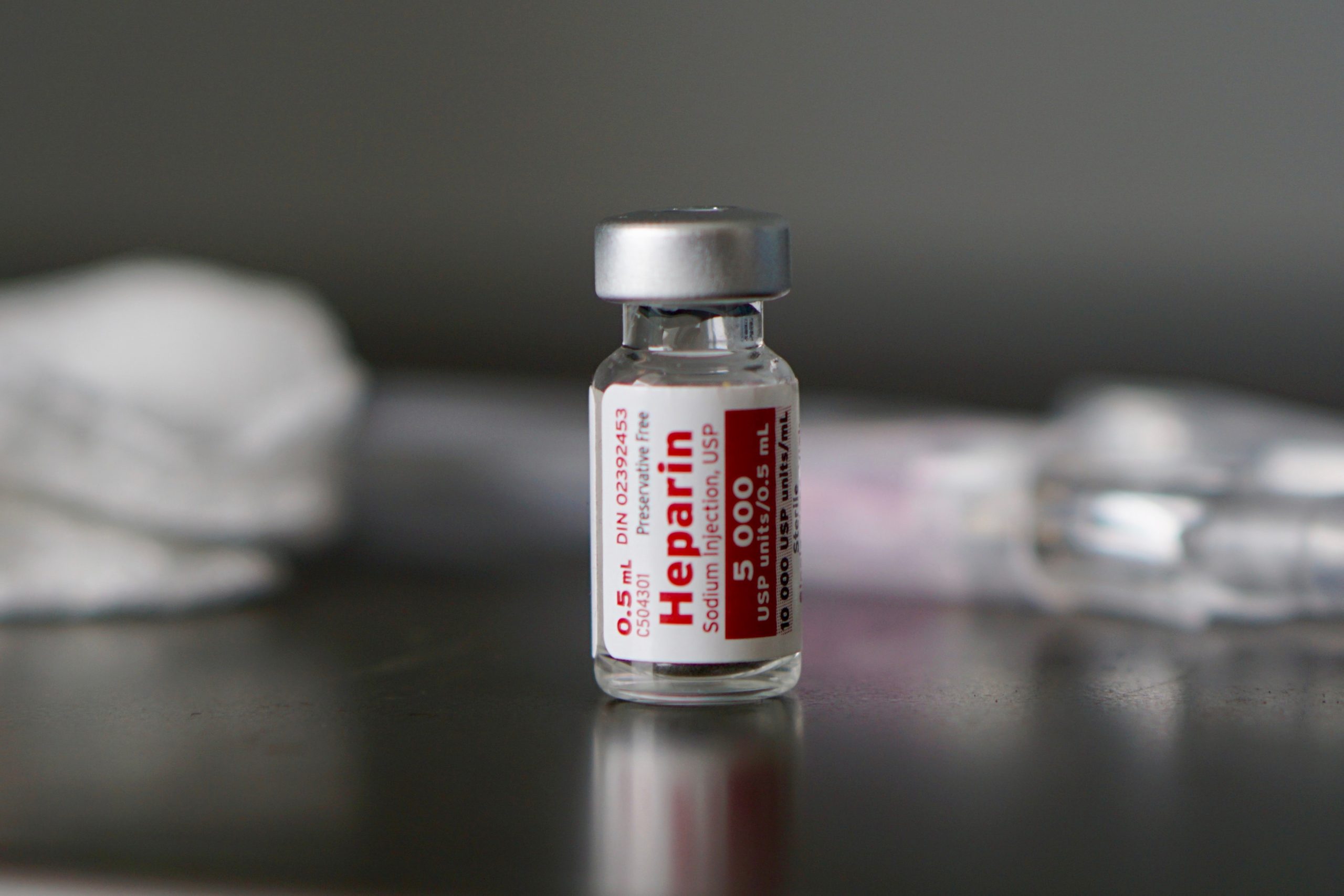 Vial labelled heparin. [Credit: SamaraHeisz5 / Shutterstock.com].