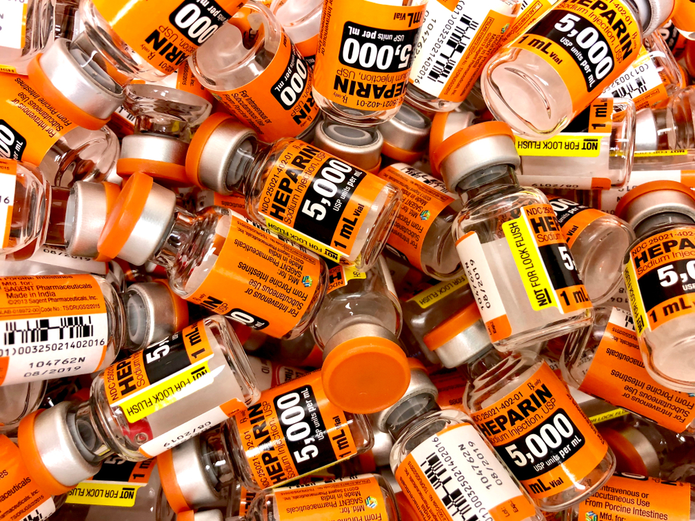 Vials of heparin filling the screen [Credit: JLMcAnally / Shutterstock.com].