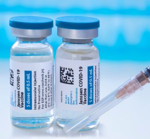 Two vials labelled 'Janssen COVID-19 Vaccine' [Credit: oasisamuel/Shutterstock.com].