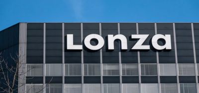 Lonza Logo on top of grey building in Basel, Switzerland [Credit: Taljat David / Shutterstock.com].