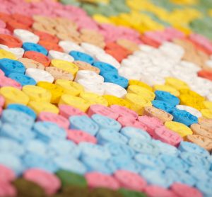 Hundreds of brightly coloured MDMA (Ecstasy) pills