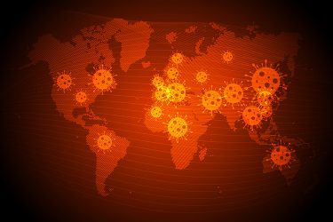 World map in red with orange coronavirus particles over the top - idea of COVID-19 pandemic