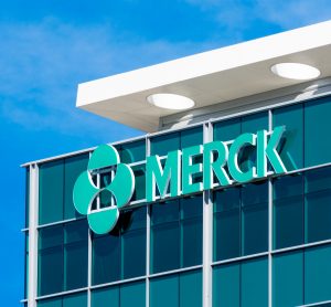 Close up view of the Merck logo on the top corner of a glass building [Credit: Michael Vi / Shutterstock.com].