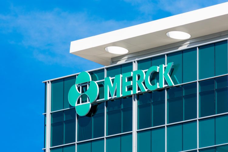 Close up view of the Merck logo on the top corner of a glass building [Credit: Michael Vi / Shutterstock.com].
