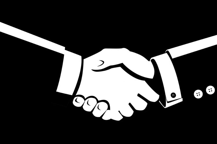 Black and white illustration of shaking hands - idea of mergers and acquistions