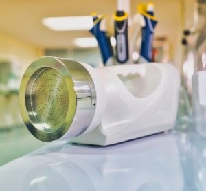 Portable microbial air sampler on a blurred laboratory background