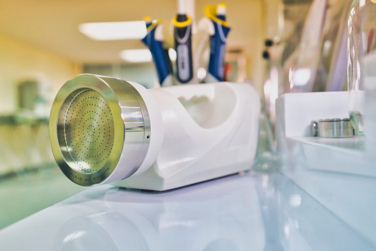 Portable microbial air sampler on a blurred laboratory background