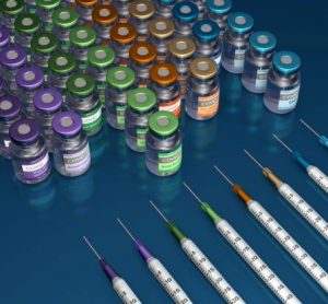 Different COVID-19 vaccine types indicated by lines of vials labelled 'COVID-19 Vaccine' and syringes in different colours.