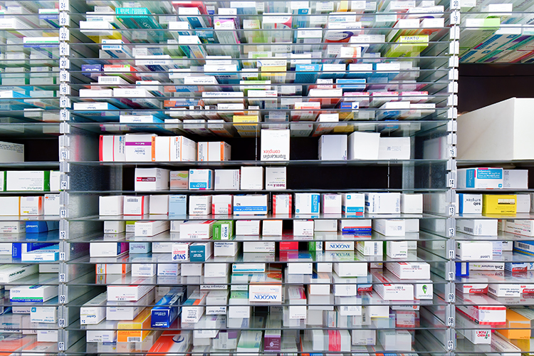 shelves of boxes containing pharmaceuticals - idea of pharmaceutical packaging