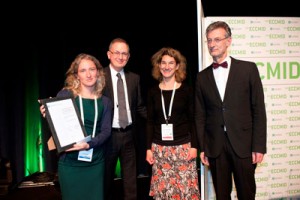 Hilde de Clerck from MSF is presented with her award by Murat Akova President of ESCMID, and Winfried Kern, Programme Director at ECCMID