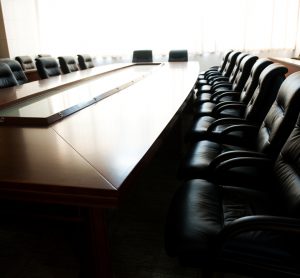 Conference table and chairs in meeting room - idea of a board of directors