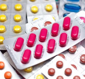 various colours of tablets/pills in blister packaging