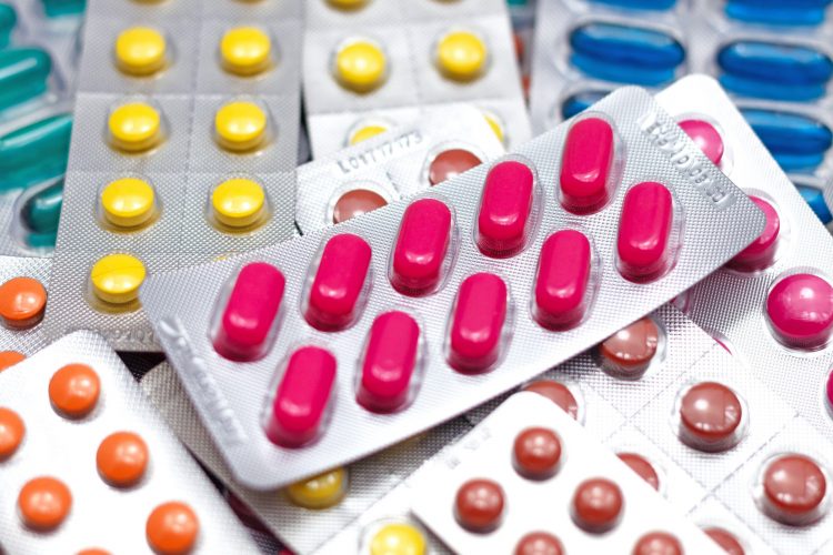 various colours of tablets/pills in blister packaging